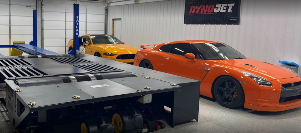 two cars with dyno jet inside Regal Motorsports